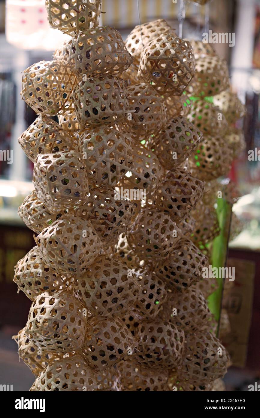Bamboo cages with crickets at the Birds and Crickets market in Shanghai. Stock Photo