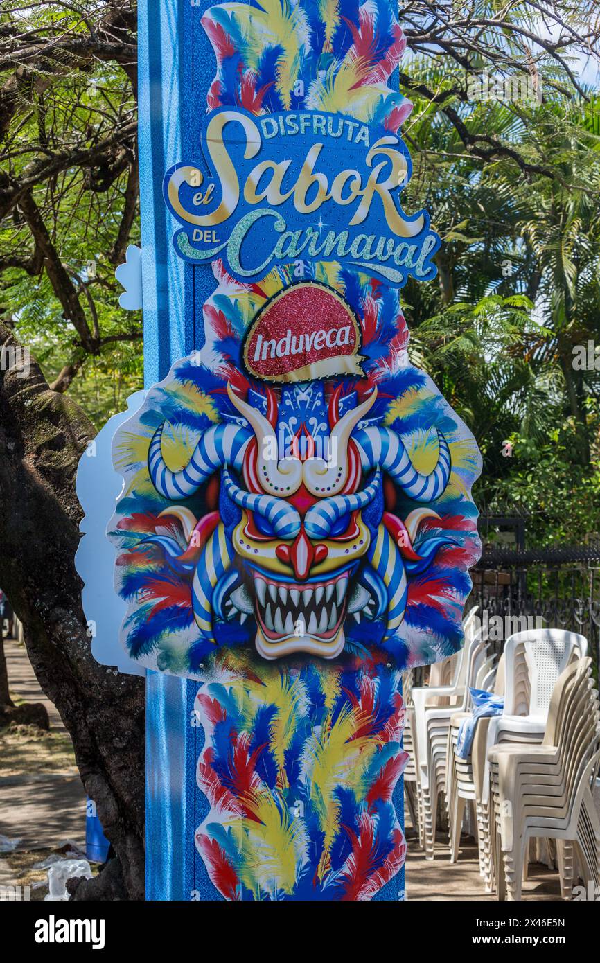 Sign with a Limping Devil or Diablo Cojuelo costume at the La Vega Carnival in the Dominican Republic.  The first documented Carnival celebration in w Stock Photo