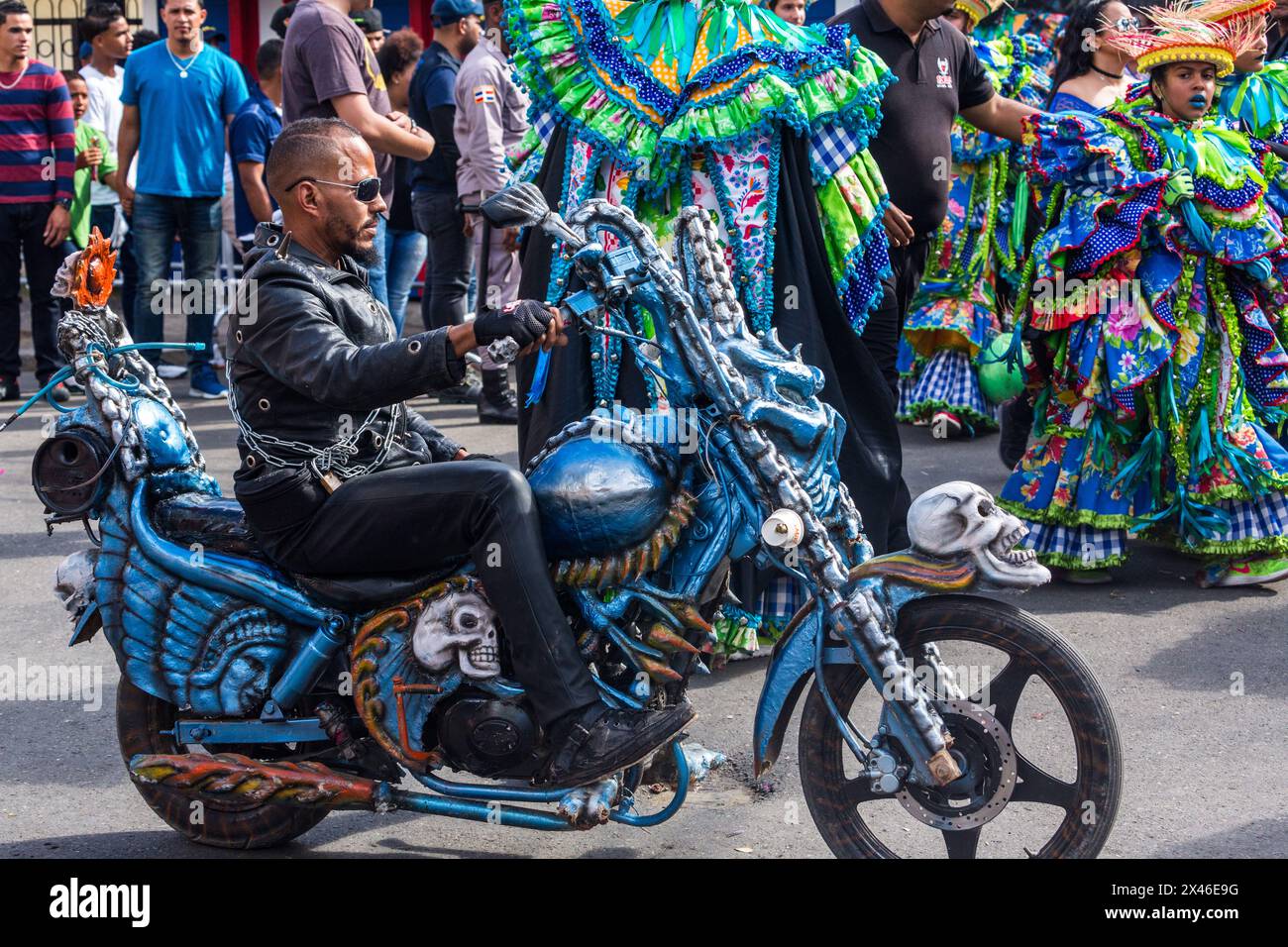 Man on a customized motorcycle in the Carnival parade in La Vega in the Dominican Republic.  The first documented Carnival celebration in what is now Stock Photo