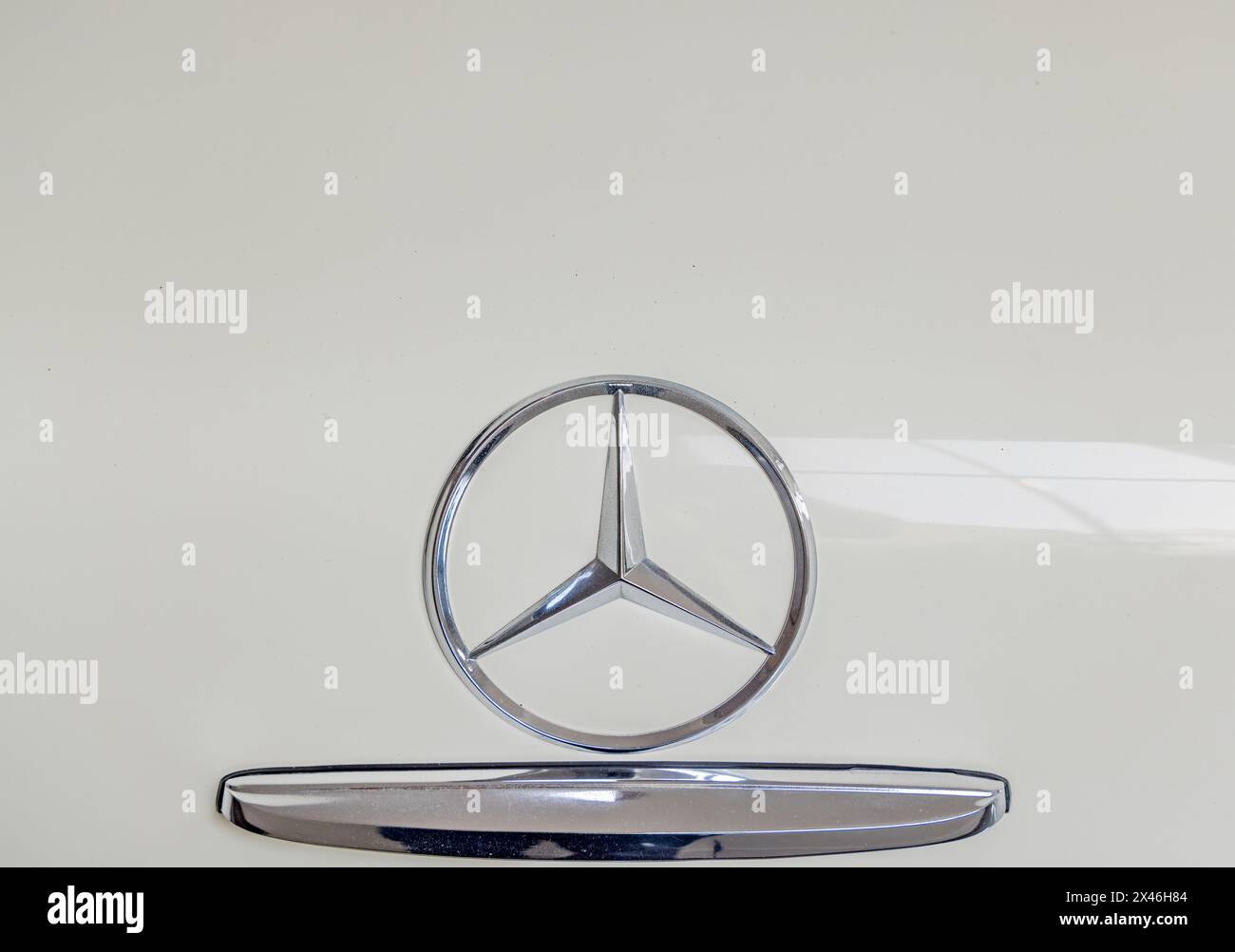 detail image of a three pointed silver star on a 280 sl mercedes's trunk Stock Photo