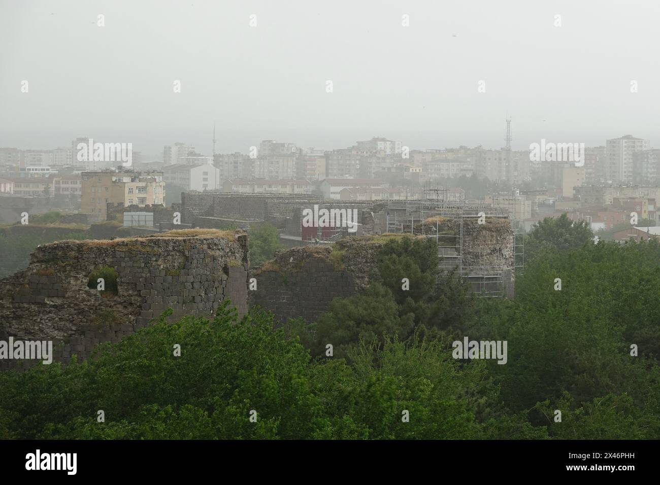 General view of dense smog over Diyarbakir. Twenty-three provinces in southeastern Turkey have been hit by heavy dust clouds from North Africa. The dust clouds, which have been effective since the end of last week, have affected the provinces of Diyarbakir, Mardin, Siirt, Sirnak, Batman, Bitlis, Bingol, Elazig, Malatya, Adiyaman, Kahramanmaras, Gaziantep, Kilis, Hatay, Adana, Osmaniye, Mersin, Karaman, Konya, Ni?de and Aksaray, including the capital Ankara. Elderly and sick people were warned not to go out. Turkey's General Directorate of Meteorology announced that the dust cloud was most inte Stock Photo