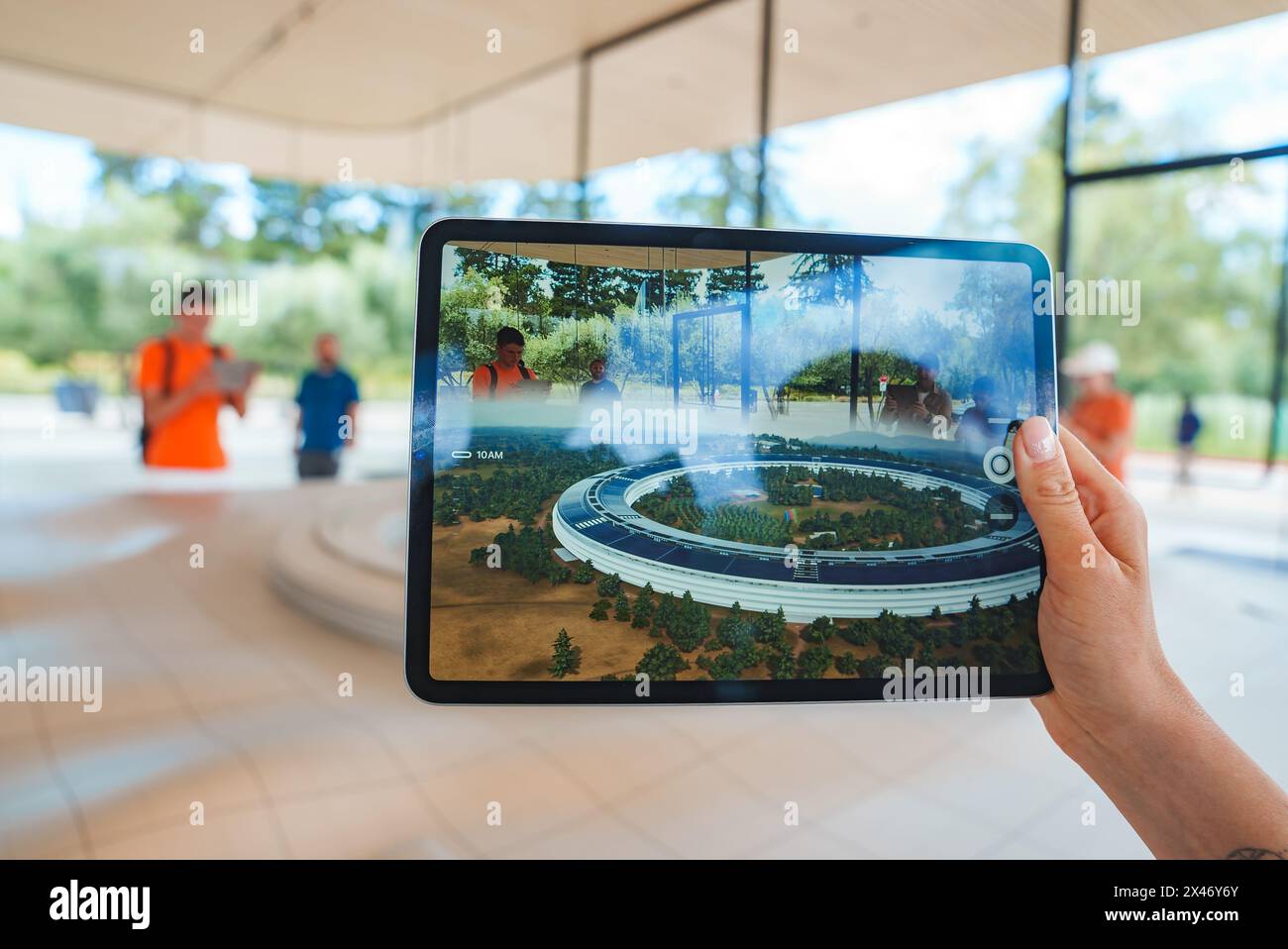 Tablet display showcasing Apple Park at Apple Store in Mountain View, CA Stock Photo