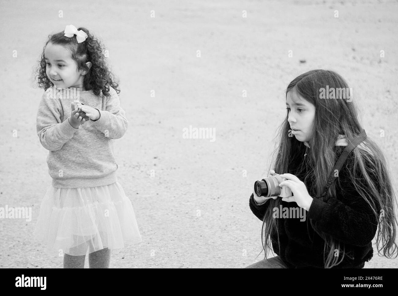 Two girls outdoors in black and white Stock Photo - Alamy