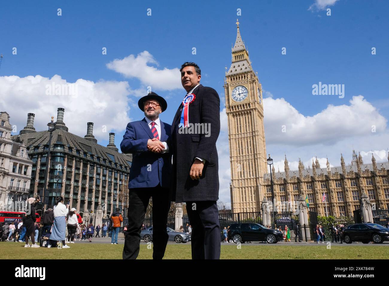 George Galloway poses for a photo with a Workers Party of Britain candidate standing at the next General Election after a press conference. Stock Photo