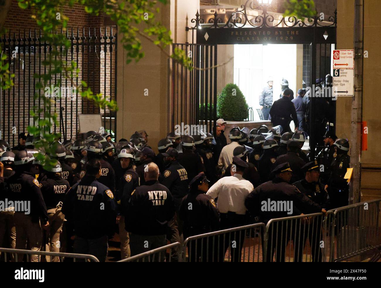 New York, United States. 30th Apr, 2024. NYPD police officers move into ...