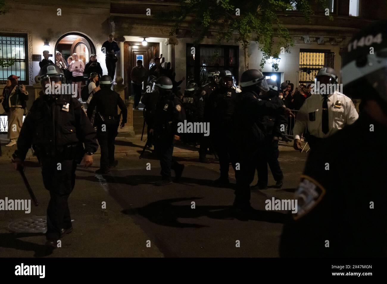 New York, United States. 30th Apr, 2024. NYPD in riot gear try to get ...