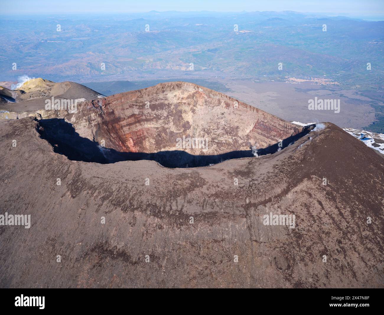 AERIAL VIEW. Summit of Mount Etna with the NorthEast Crater which formed in 1911, the main crater is behind on the left. Sicily, Italy. Stock Photo