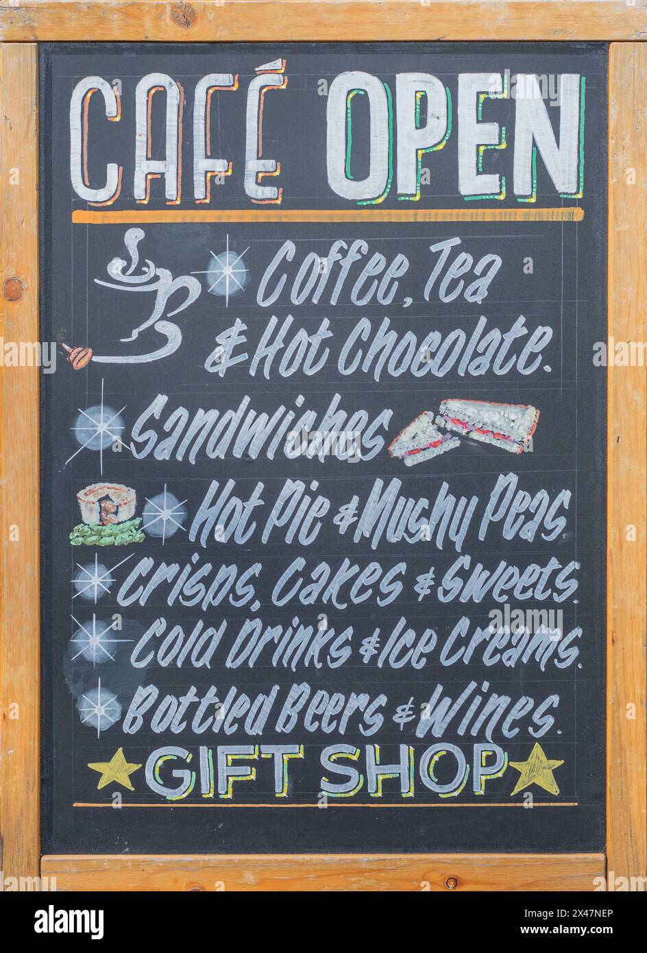 Cafe Open sign on black board surrounded by wood frame advertising various items Stock Photo