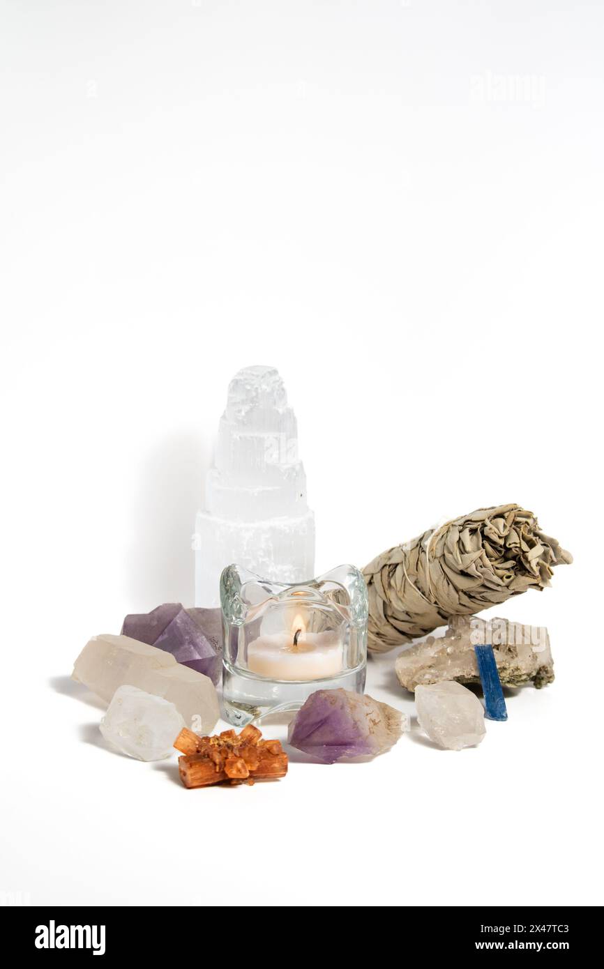 Crystals and Sage with candle isolated white background Stock Photo