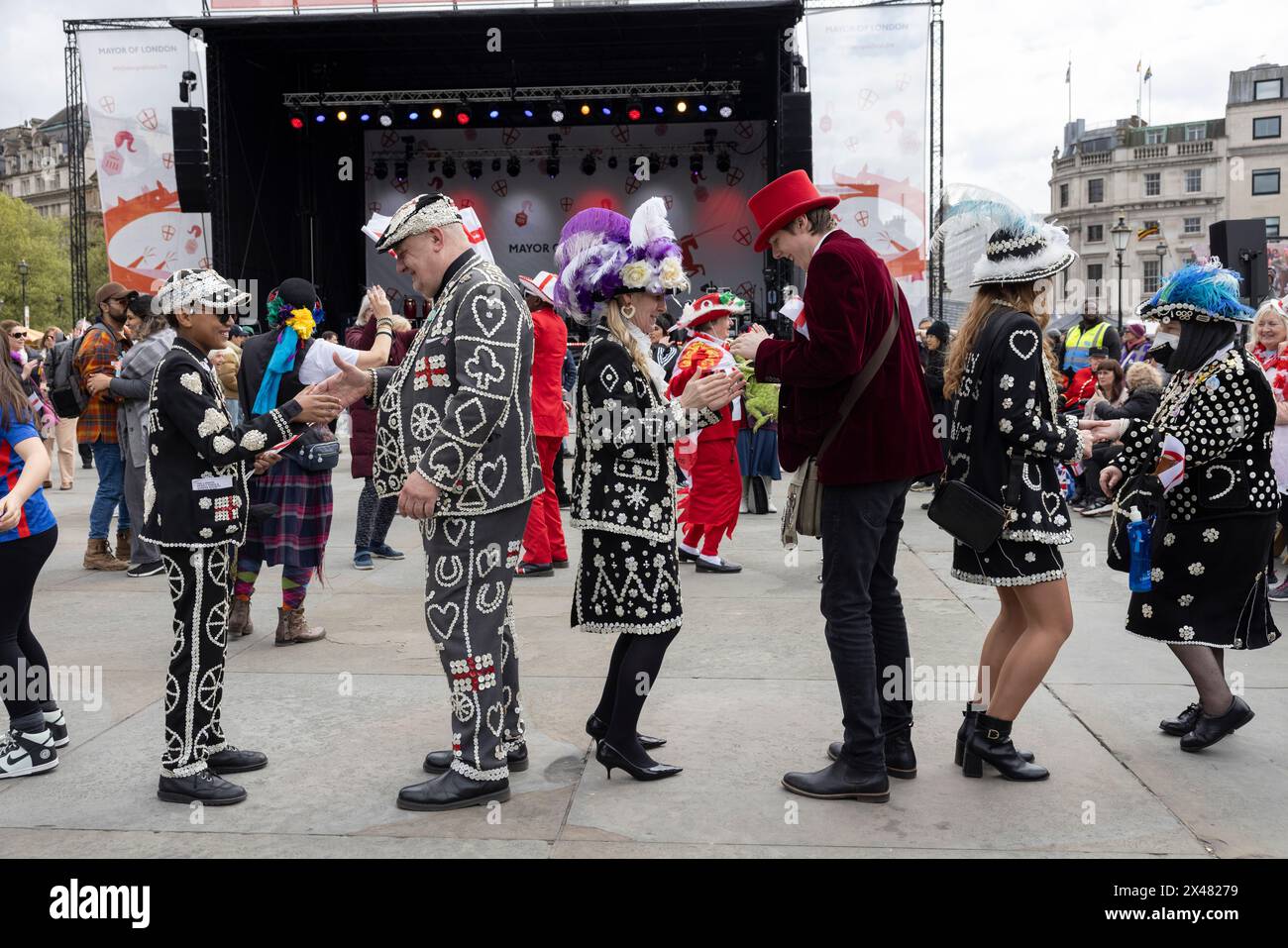 The Feast of St. George Festival in Trafalgar Square, April 23rd 2024 including Pearly Kings and Queens to celebrate celebrate Patron Saint of England. Stock Photo