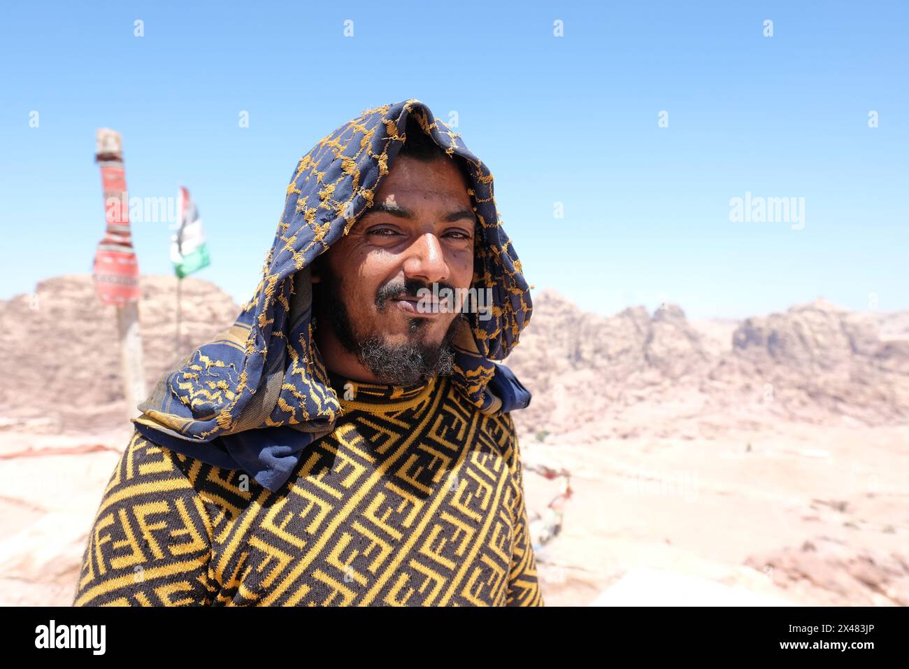 Petra Jordan local Bedouin man who runs a tea and coffee tent high up at the High Place of Sacrifice above the ancient city of Petra photo 2023 Stock Photo