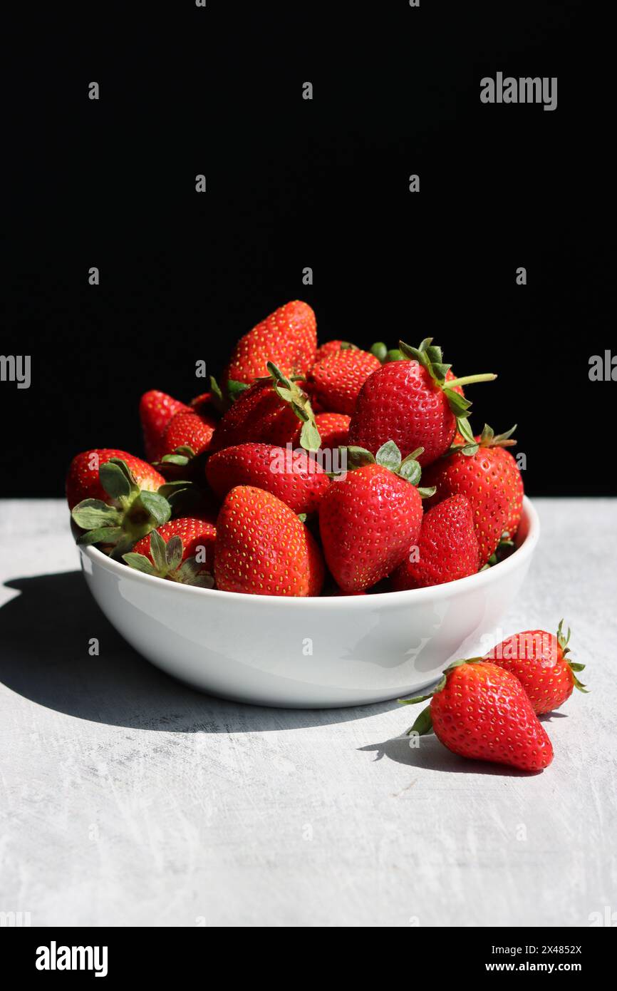 Red ripe strawberries background. Strawberry texture close up photo. Fresh organic berries macro. Eating fresh concept. Stock Photo