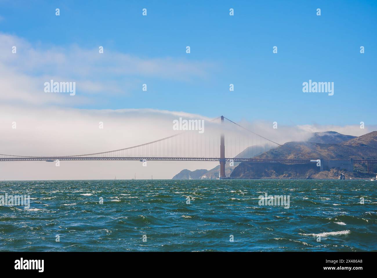 Golden Gate Bridge view from water with fog, San Francisco, California. Stock Photo