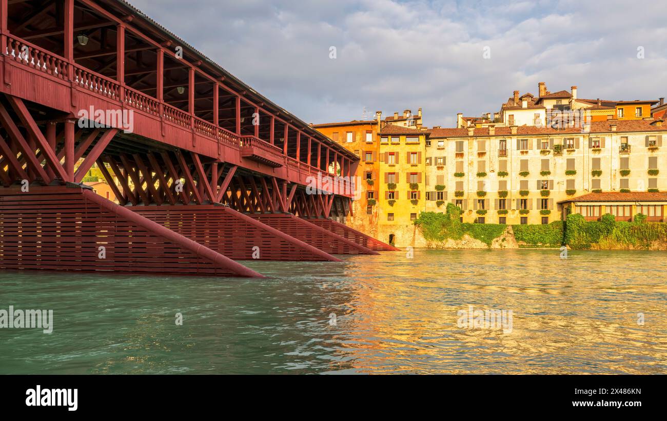 Antique wooden covered red bridge. Ponte Vecchio or Ponte degli Alpini over Brenta river, Bassano del Grappa, Vicenza province, Veneto region, Italy. Stock Photo