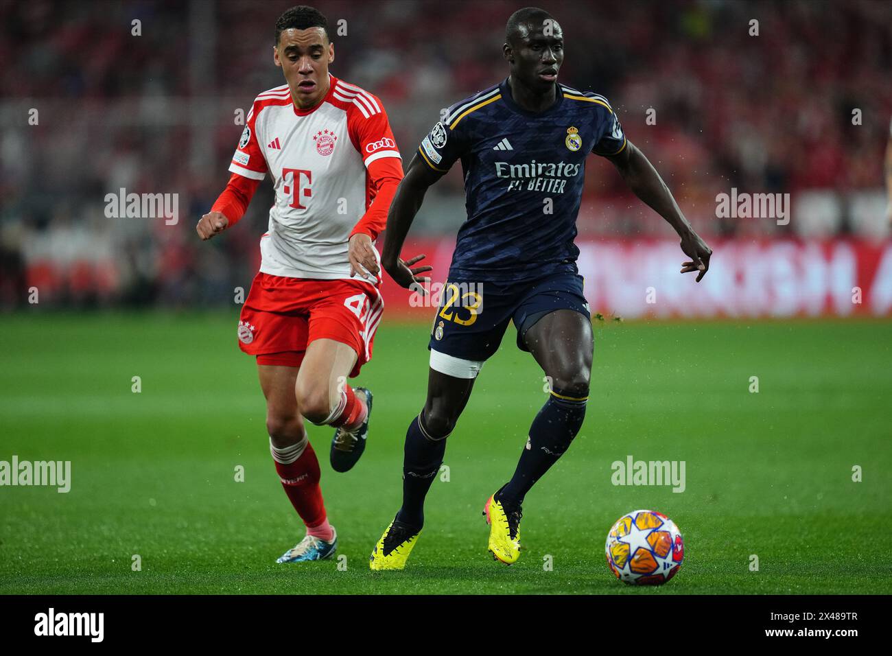 Munich, Germany. 30th Apr, 2024. Ferland Mendy of Real Madrid and Jamal Musiala of Bayern Munchen during the UEFA Champions League match, Semi-finals, first leg, between FC Bayern Munchen and Real Madrid played at Allianz Stadium on April 30, 2024 in Munich, Germany. (Photo by Bagu Blanco/PRESSINPHOTO) Credit: PRESSINPHOTO SPORTS AGENCY/Alamy Live News Stock Photo