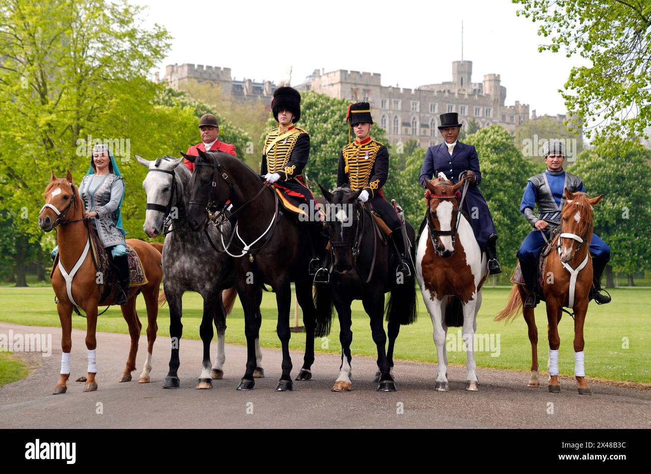 (Left to right) Khayalya Ahmadova riding Mil, part of the Equestrian Federation of Azerbaijan, Chris Hunnable riding Mrs I Shervington's Goosey Gander, Captain Whittingham riding Reggie and Gunner Martin riding Kernow of The Musical Drive of the King's Troop Royal Horse Artillery, Katie Jerram-Hunnable riding His Majesty the Kings's Sunbeam and Hasan Pashayev riding Sel of the Equestrian Federation of Azerbaijan during a photo call at the Royal Windsor Horse Show, Windsor. Picture date: Wednesday May 1, 2024. Stock Photo