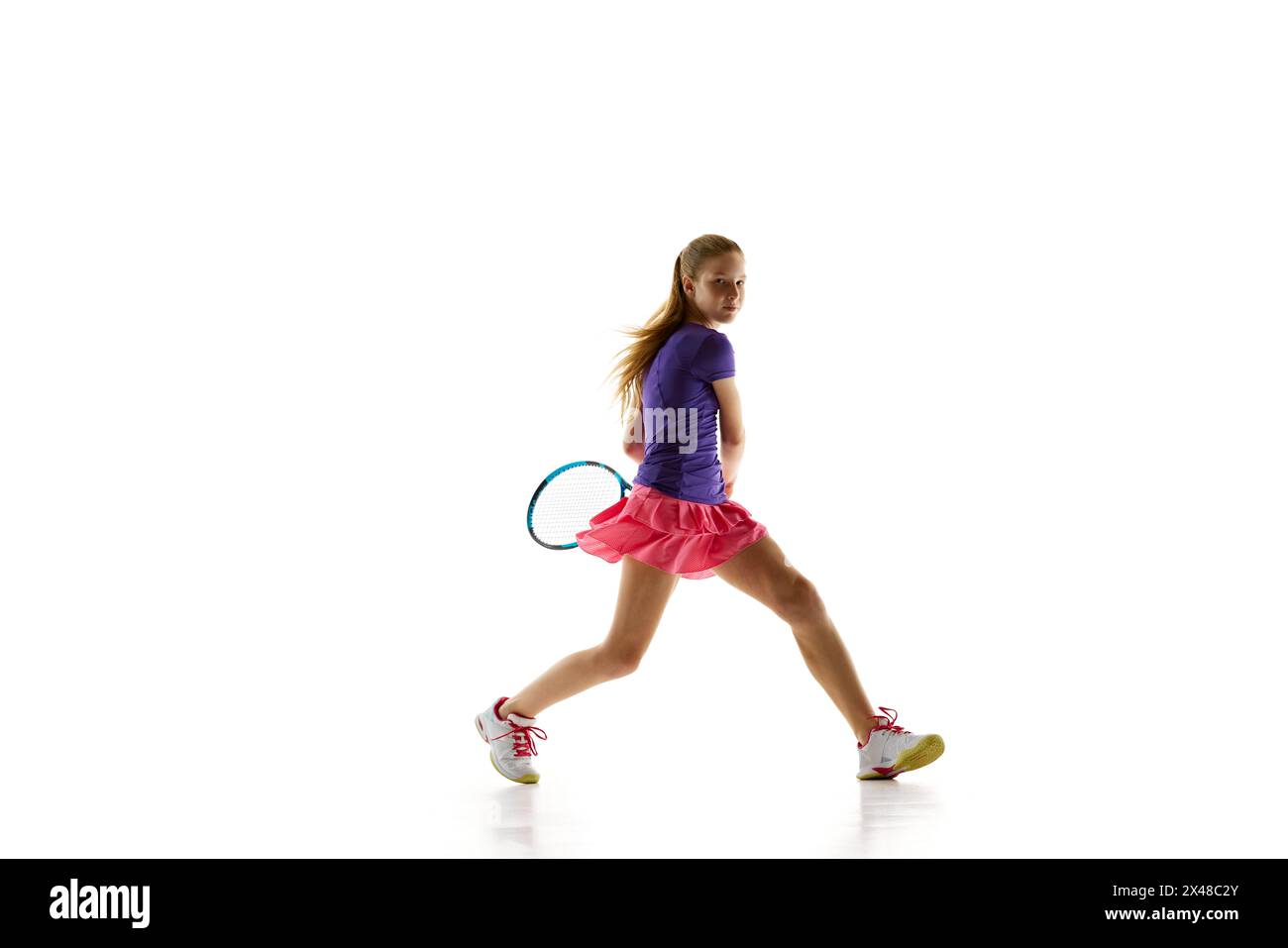 Athlete teenage girl, tennis player in uniform ready to hitting two