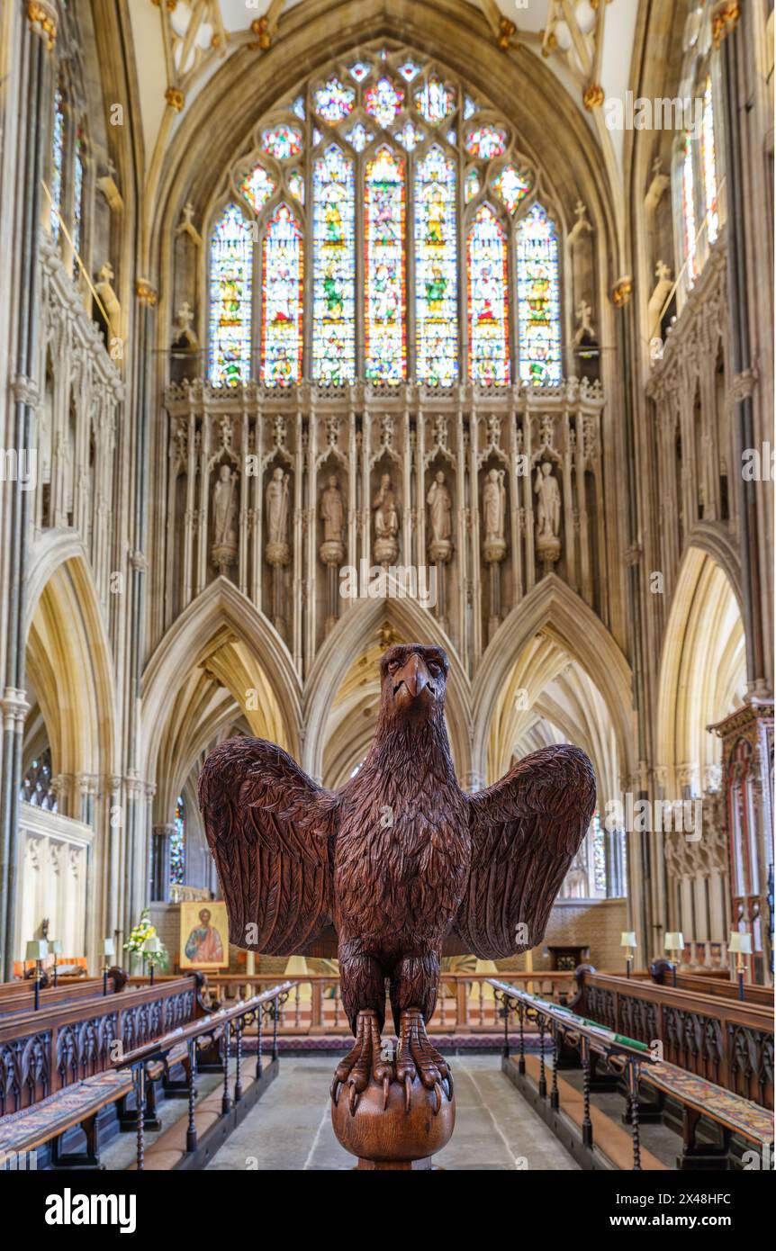 Carved wooden eagle lectern and choir stalls of Wells Cathedral in Somerset UK Stock Photo