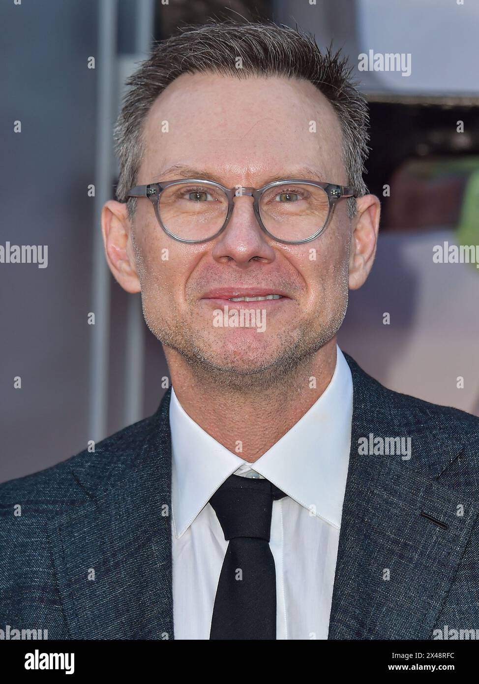 HOLLYWOOD, LOS ANGELES, CALIFORNIA, USA - APRIL 30: Christian Slater arrives at the Los Angeles Premiere Of Netflix's 'Unfrosted' held at The Egyptian Theatre Hollywood on April 30, 2024 in Hollywood, Los Angeles, California, United States. (Photo by Image Press Agency) Stock Photo