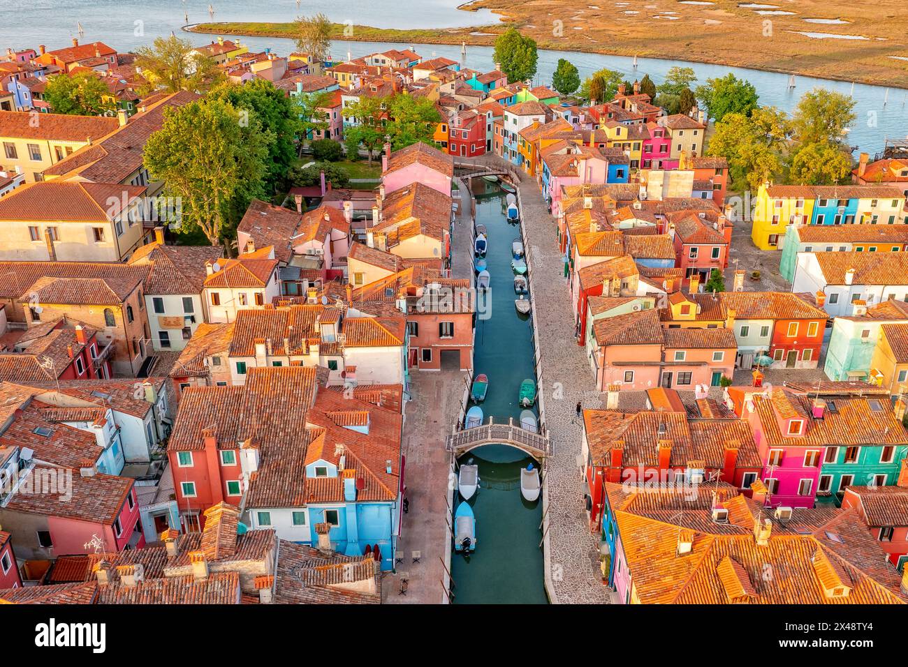 Positive colorful rainbow island of Burano. City on water Venice. Drone type. Places worth visiting Stock Photo