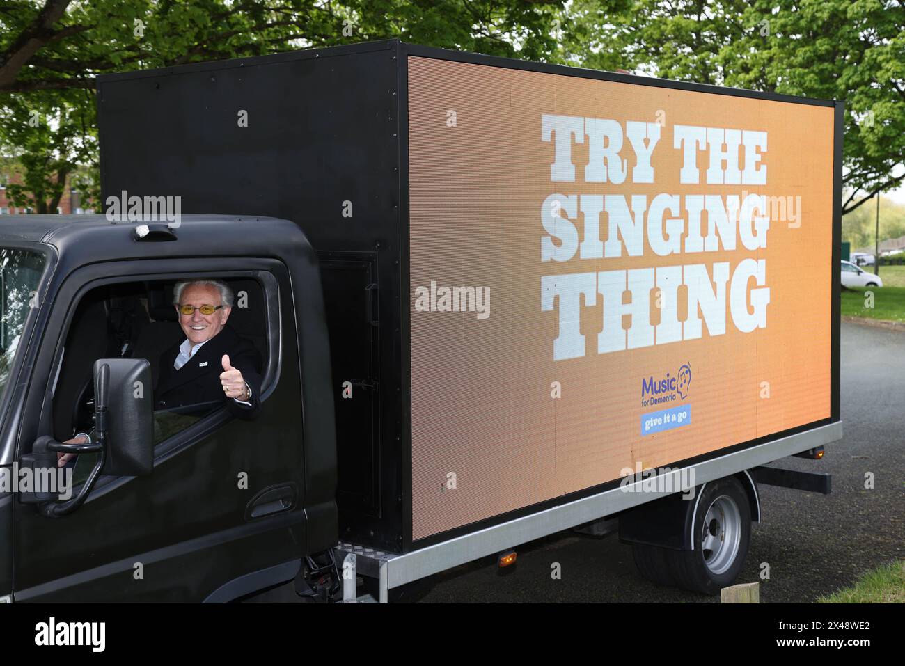 EDITORIAL USE ONLY Singer Tony Christie at the launch of Music for Dementia's new 'Give It A Go' campaign in Lichfield with the help of a mobile AdVan. Picture date: Wednesday May 1, 2024. Stock Photo