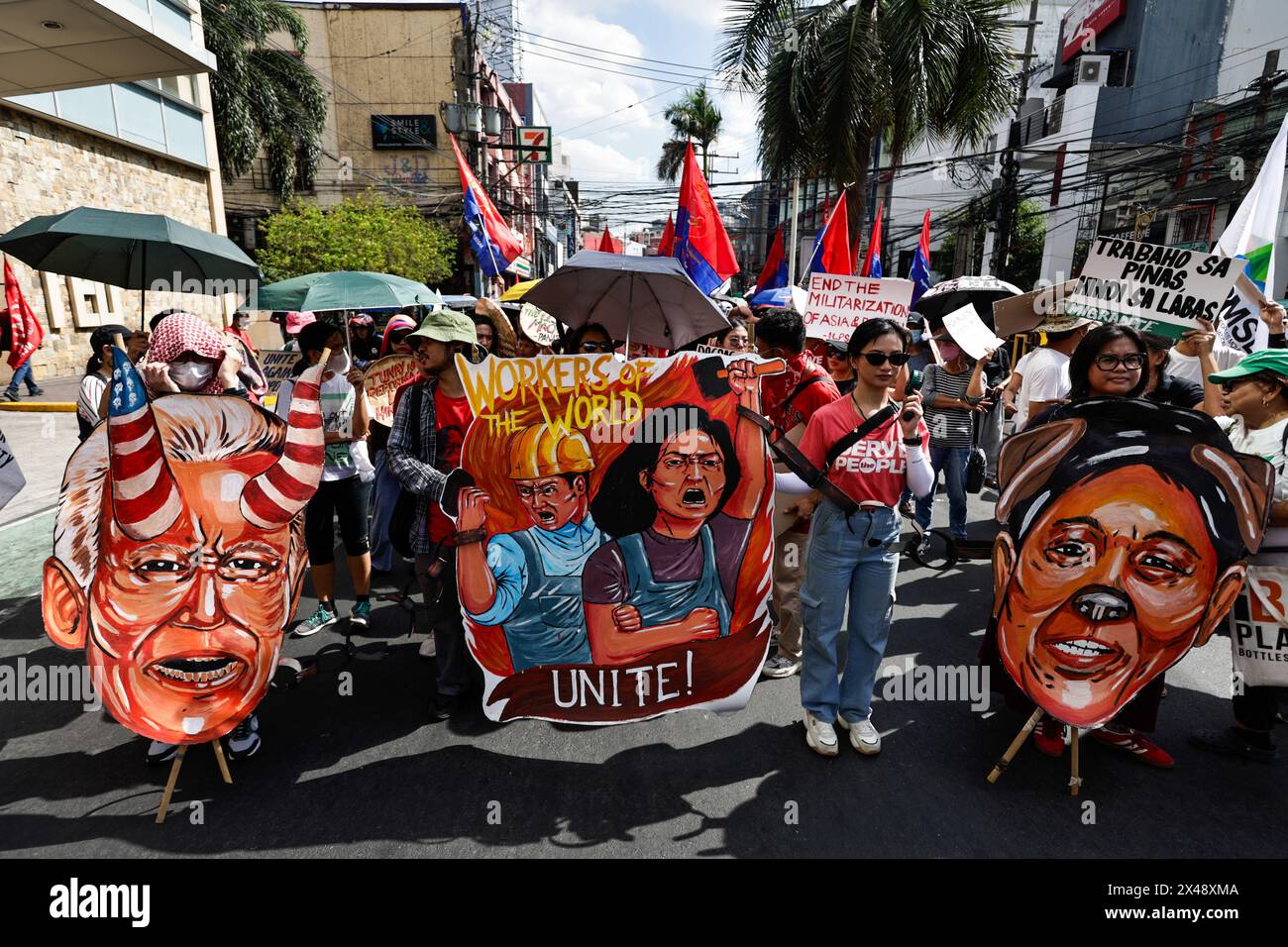 Manila, The Philippines. 1st May, 2024. Protesters holding the props ...