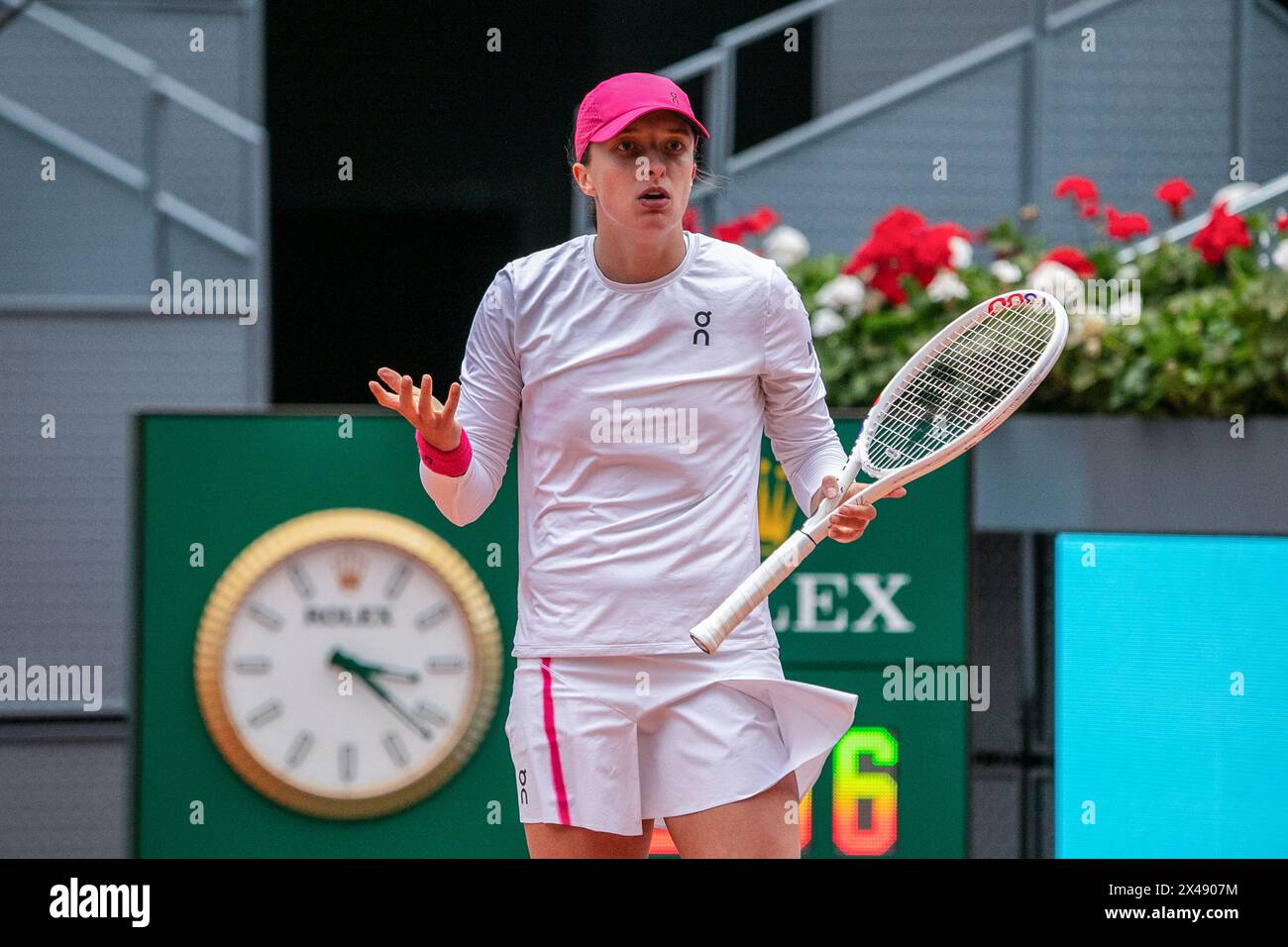 Madrid, Spain. 30th Apr, 2024. Polish tennis player Iga Swiatek in action during a tennis match on the main court of the Caja Magica in Madrid. The Polish Iga Swiatek defeated the Brazilian Beatriz Haddad Maia with sets of 4-6, 6-0 and 6-2 in their women's quarterfinal match on the eighth day of the Mutua Madrid Open at La Caja M·gica in Madrid. (Photo by David Canales/SOPA Images/Sipa USA) Credit: Sipa USA/Alamy Live News Stock Photo