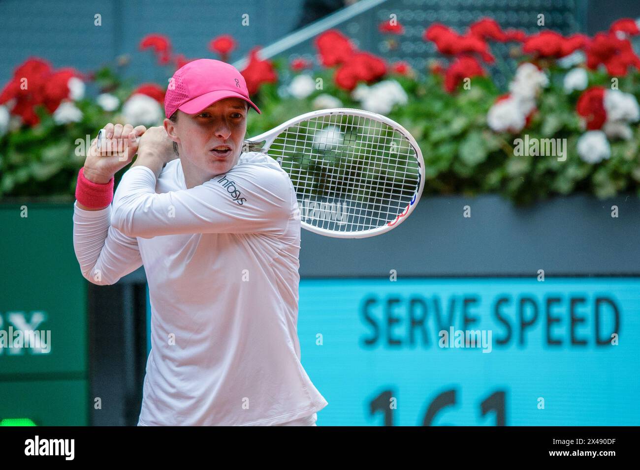 Madrid, Spain. 30th Apr, 2024. Polish tennis player Iga Swiatek, in action during a tennis match on the main court of the Caja Magica in Madrid. The Polish Iga Swiatek defeated the Brazilian Beatriz Haddad Maia with sets of 4-6, 6-0 and 6-2 in their women's quarterfinal match on the eighth day of the Mutua Madrid Open at La Caja M·gica in Madrid. (Photo by David Canales/SOPA Images/Sipa USA) Credit: Sipa USA/Alamy Live News Stock Photo