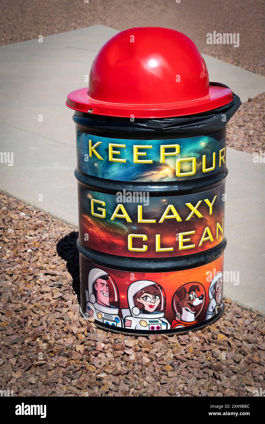 Jetson like cartoon characters illustrate a park trash can with illustrations and message to Keep our Galaxy Clean, located at the Space Museum in Ala Stock Photo