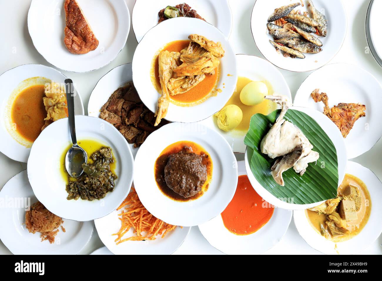 Top View Nasi Padang, various Minang Side Dish on the Table Stock Photo