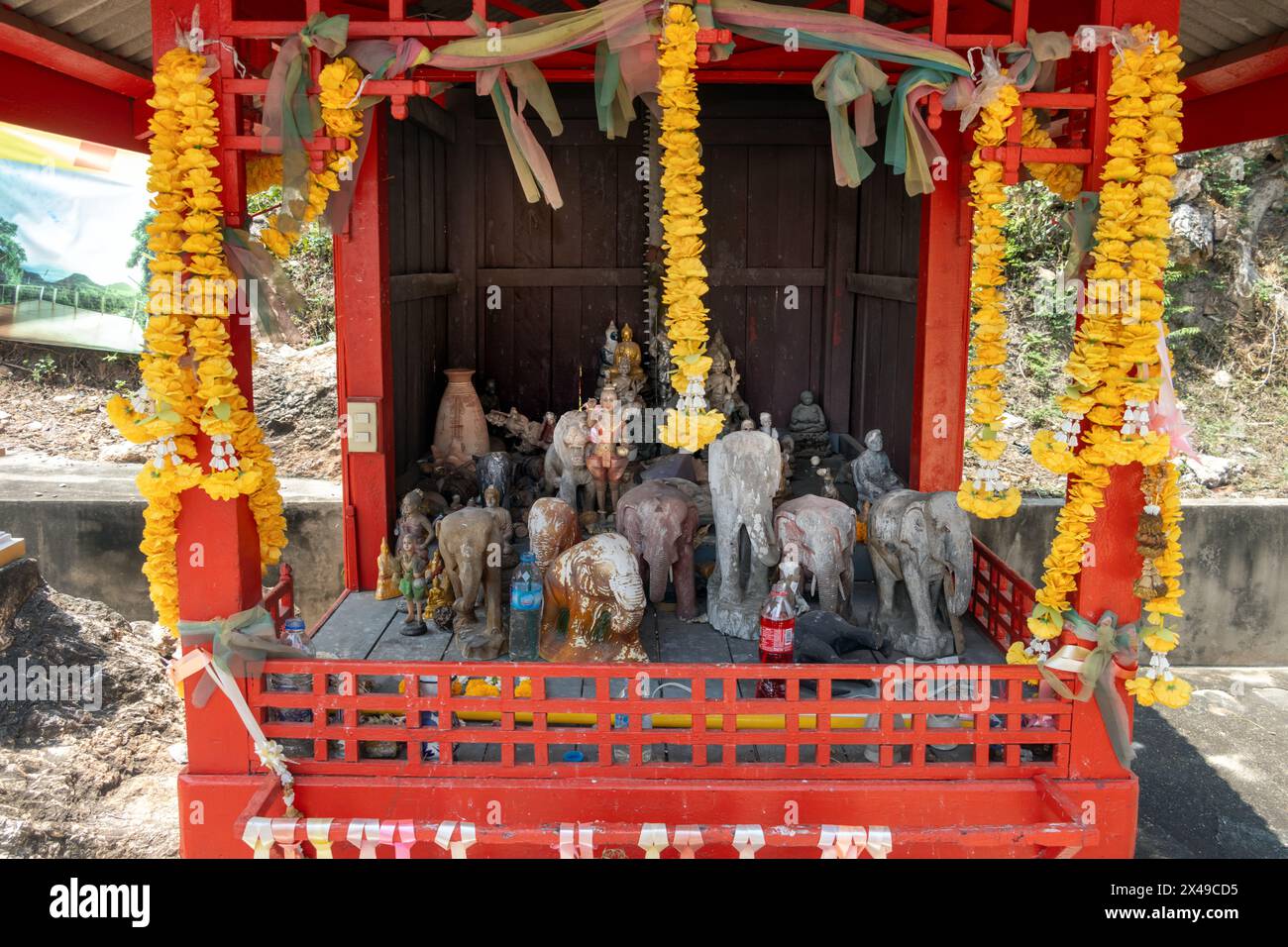 The decorative figure dools arranged inside a ghost house in a Buddhist temple, Thailand Stock Photo