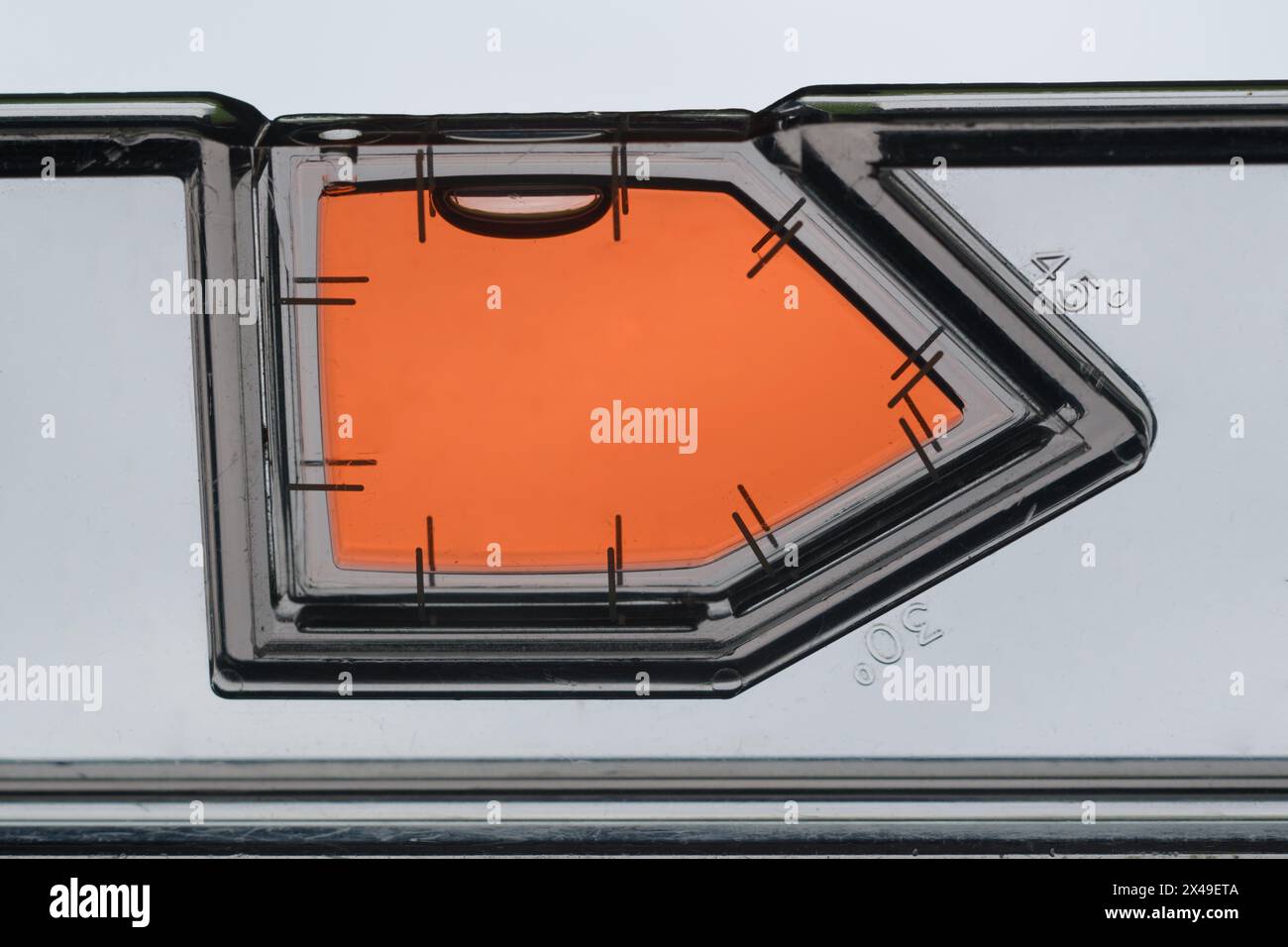 A spirit level is used to accurately measure whether a surface is level ...