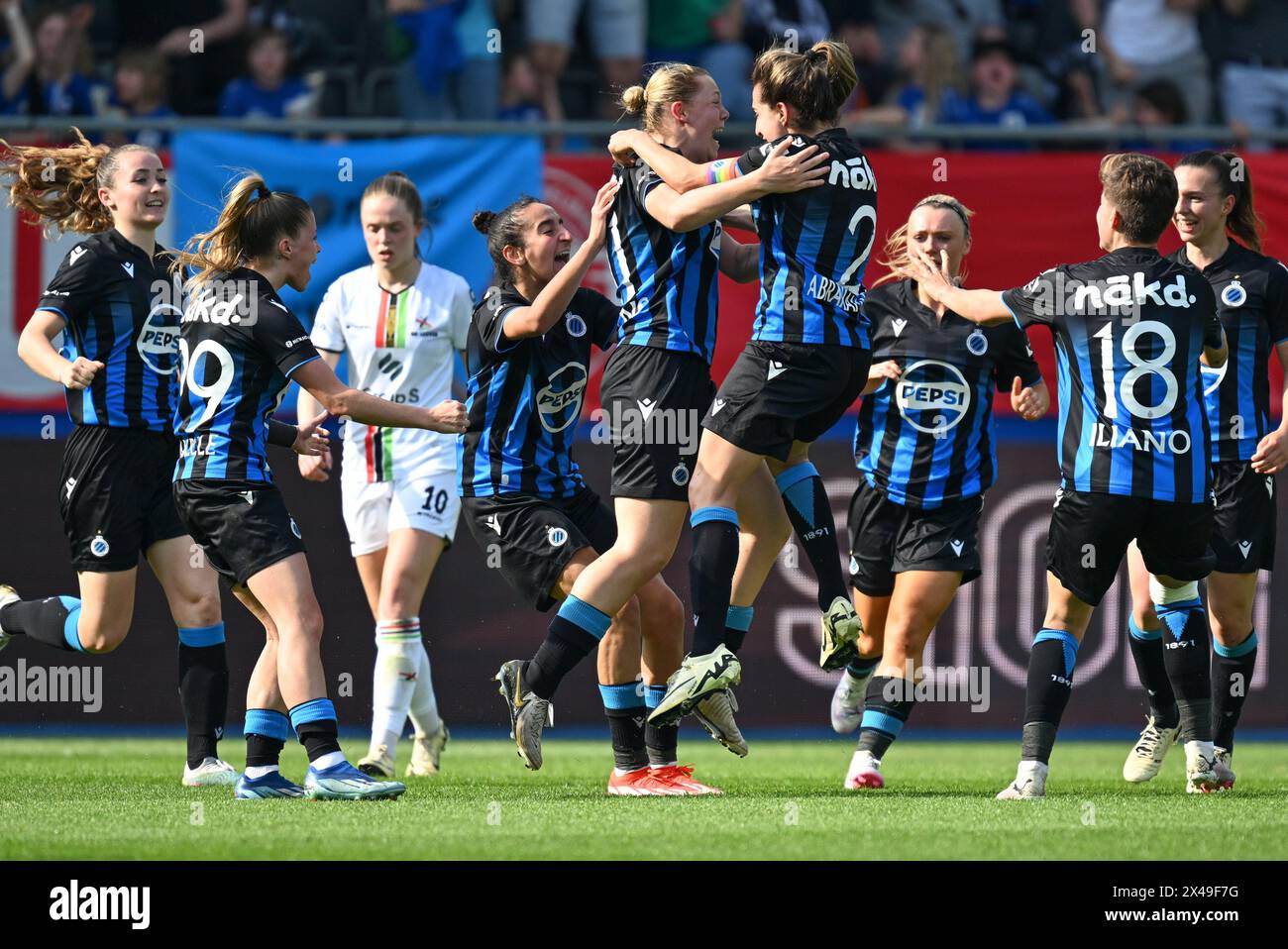 Caitlin Lievens (21) of Club YLA celebrating with teammates after