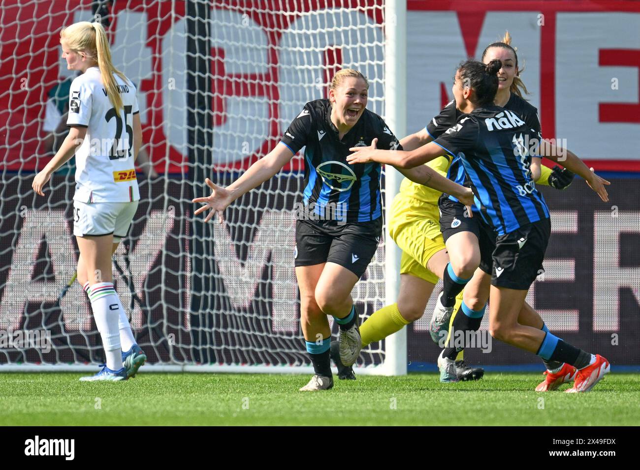 Caitlin Lievens (21) of Club YLA celebrating with teammates after