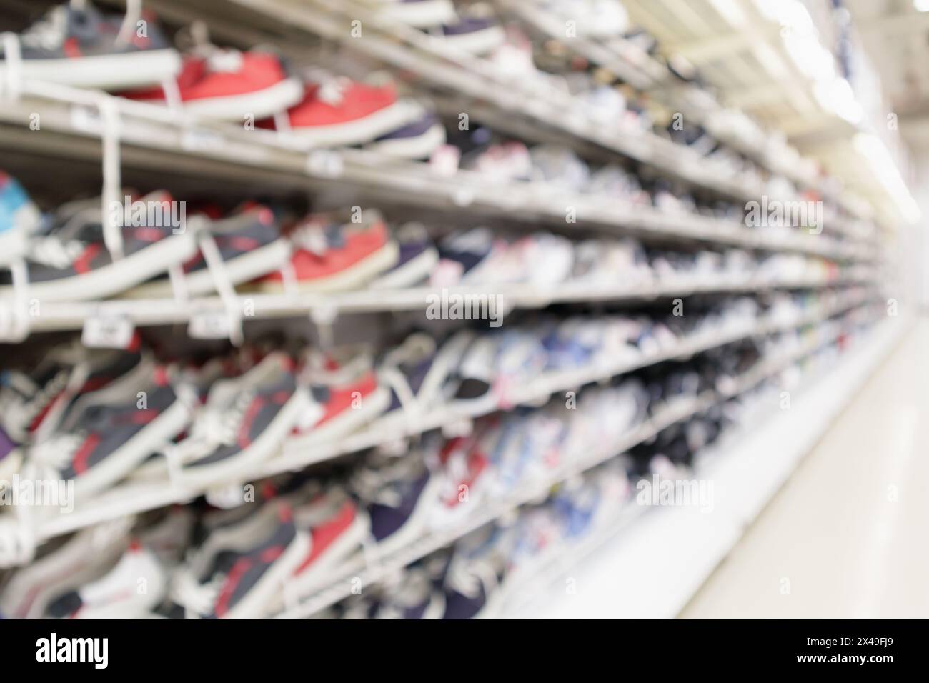 Abstract blur sport shoes on shelves in sneakers shop store background Stock Photo