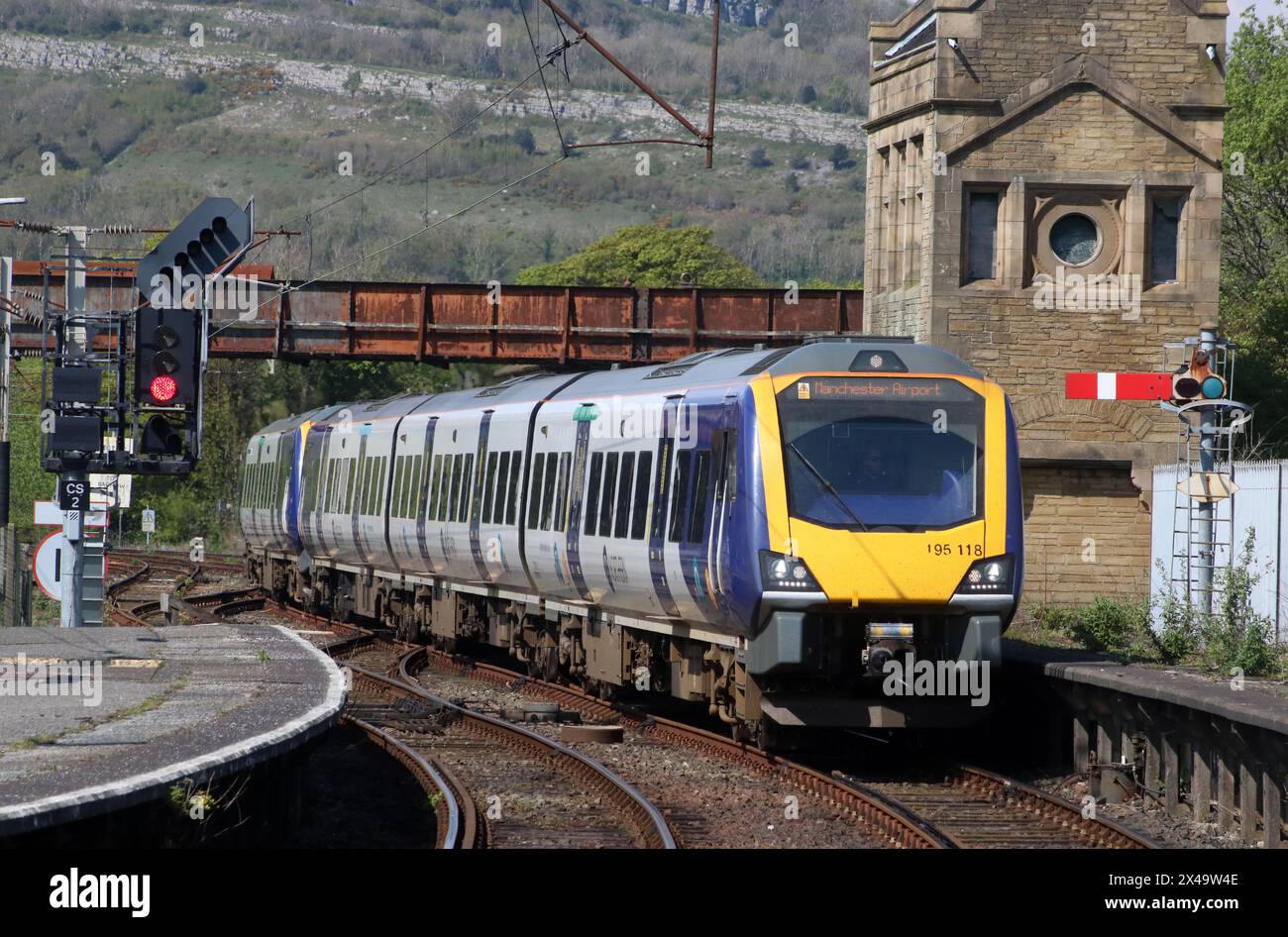 Two Northern trains class 195 civity diesel multiple-units arriving at Carnforth station with train to Manchester Airport on 1st May 2024. Stock Photo
