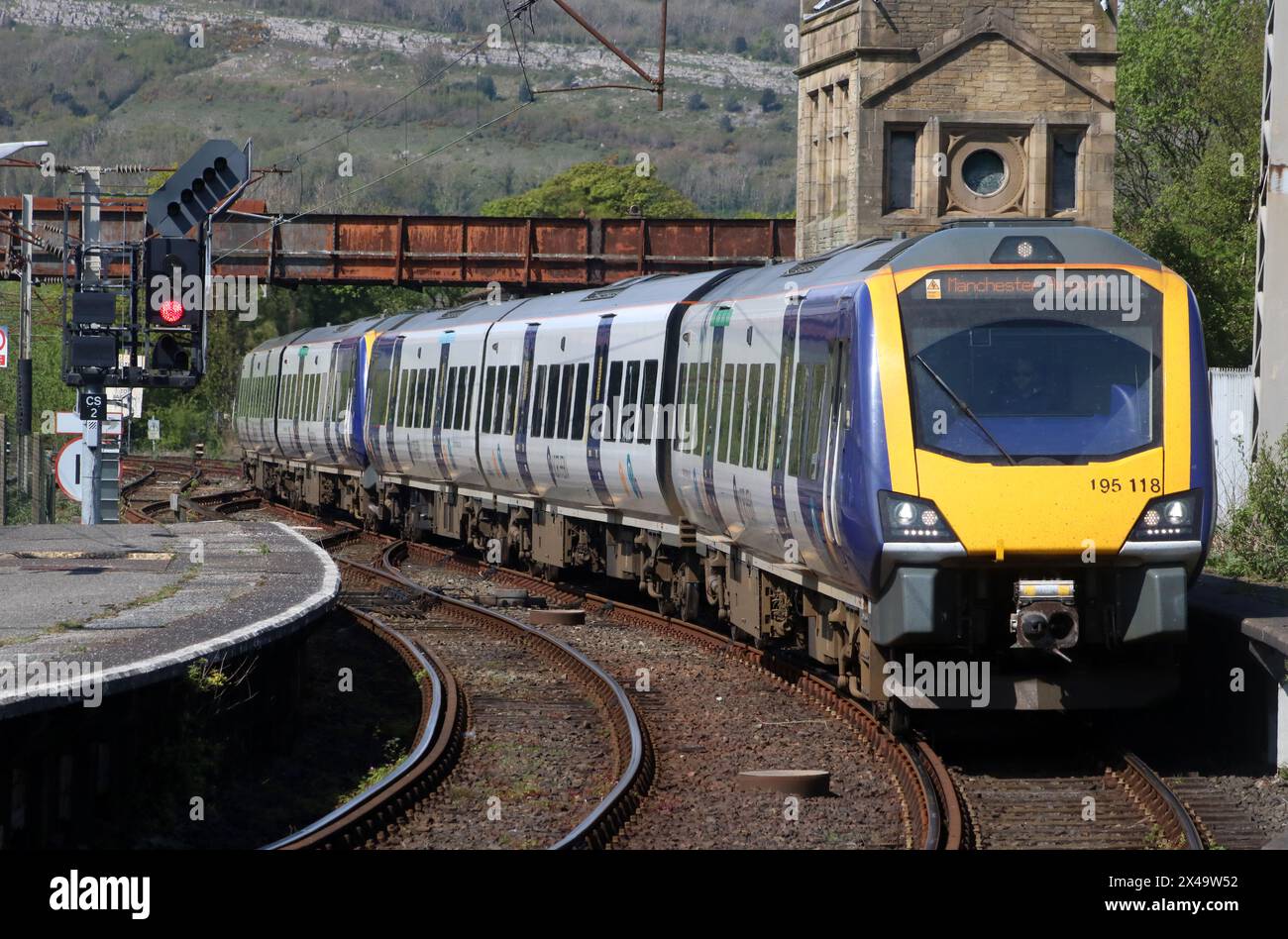 Two Northern trains class 195 civity diesel multiple-units arriving at Carnforth station with train to Manchester Airport on 1st May 2024. Stock Photo