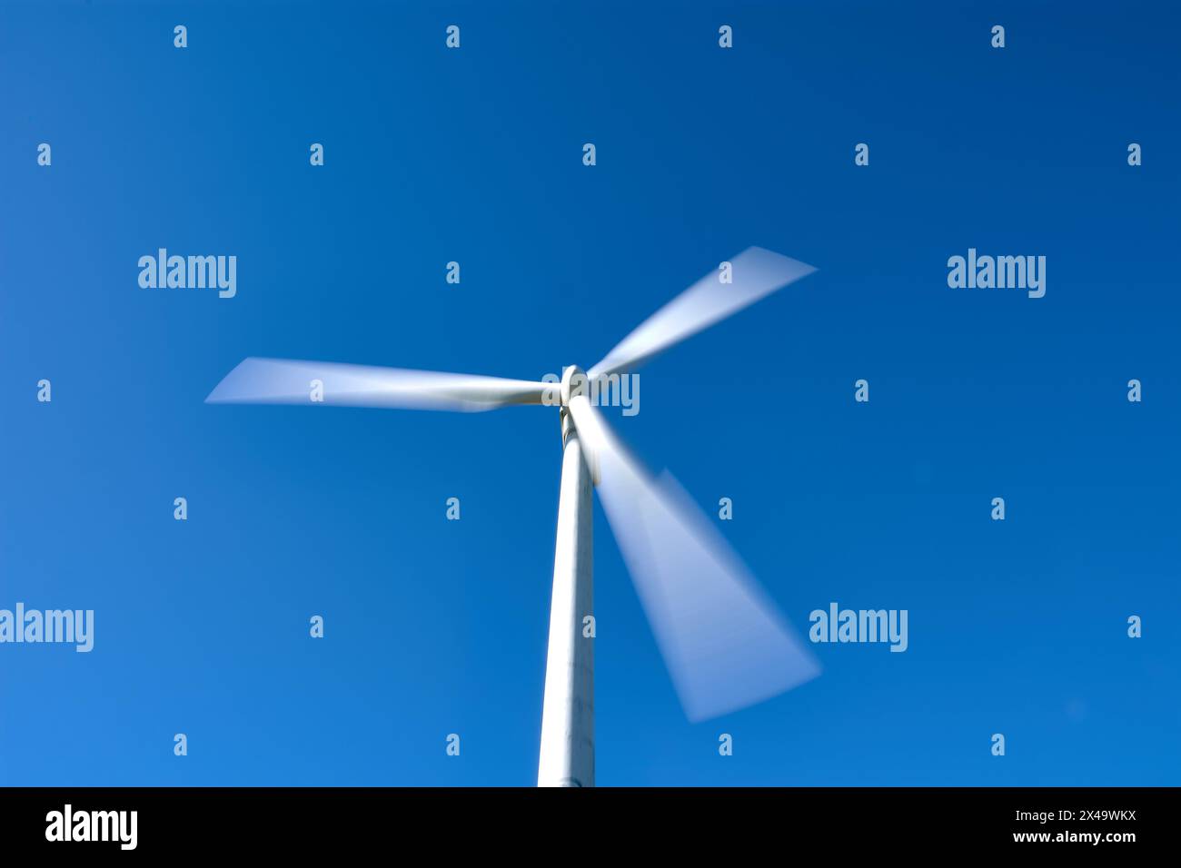 Isolated moving wind generator at the experimental Sotavento Wind Farm in Lugo, Galicia, Spain. Renewable energy concept, green energy generation. Ene Stock Photo