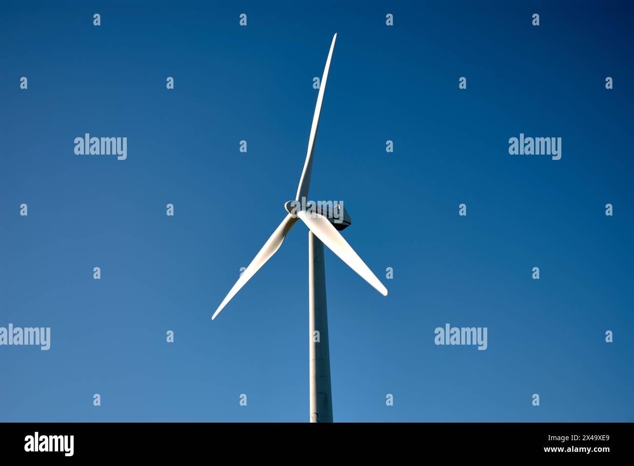 Isolated wind generator at the experimental Sotavento Wind Farm in Lugo, Galicia, Spain. Renewable energy concept, green energy generation. Energetic Stock Photo