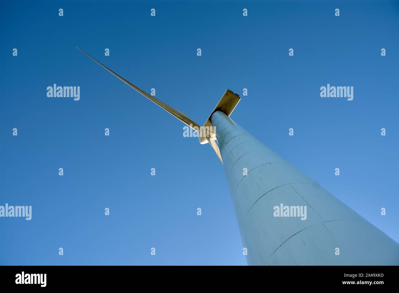 Isolated wind generator at the experimental Sotavento Wind Farm in Lugo, Galicia, Spain. Renewable energy concept, green energy generation. Energetic Stock Photo