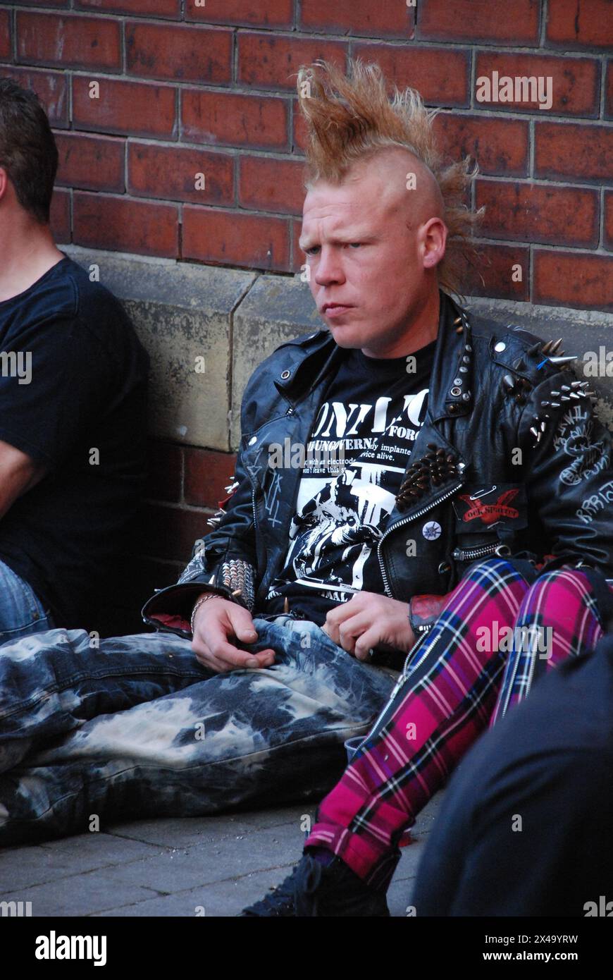 Punk rocker sitting on the floor. Rebellion Festival. 07 August 2009 Stock Photo