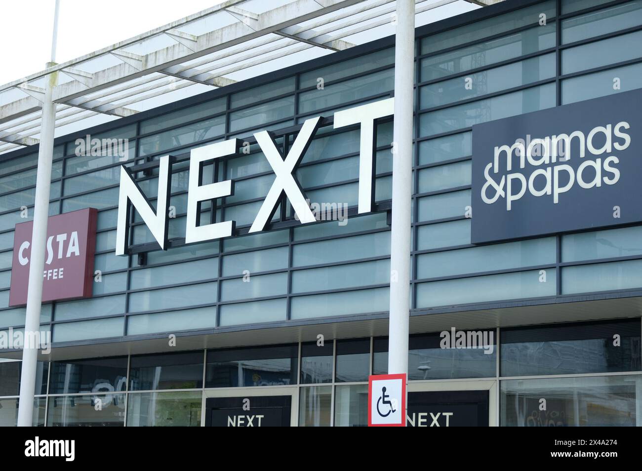 LONDON- APRIL 23, 2024: Next and Mama's and Papas on Brent South Shopping Park in NW2 north west London Stock Photo