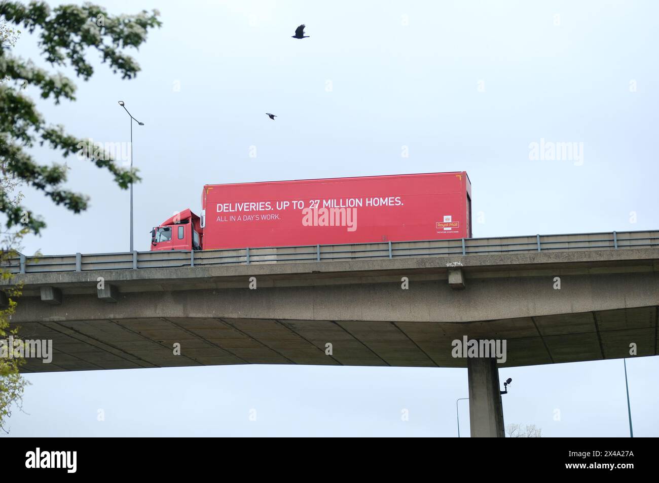 LONDON- APRIL 23, 2024: A Royal Mail lorry driving over a flyover road towards the M1 in North London Stock Photo