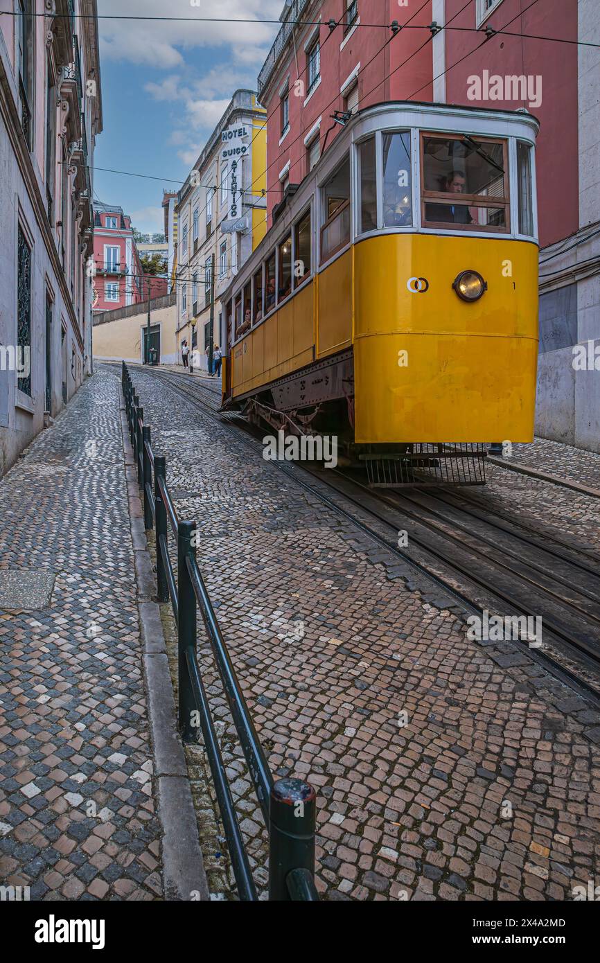 LISBON, PORTUGAL - APRIL 6, 2024: Lisbon's Gloria funicular. In service since 1885, this funicular connects downtown’s Restauradores Square to the nei Stock Photo