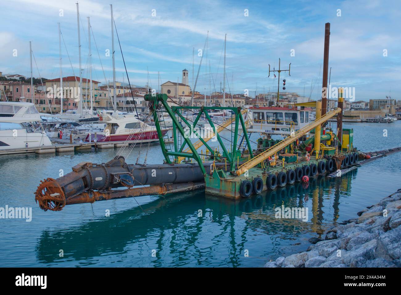 Seabed dredger in the tourist port of San Vincenzo, Tuscany, Italy Stock Photo
