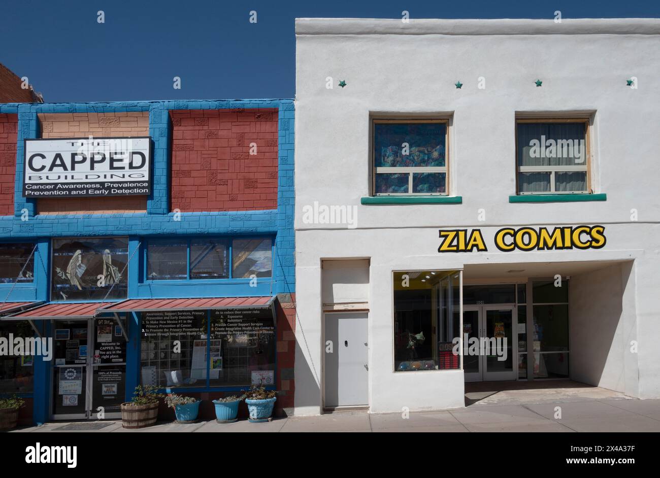 The entrance to the CAPPED nonprofit organization offering health services, alongside the Zia Comics storefront in downtown Alamogordo, NM Stock Photo