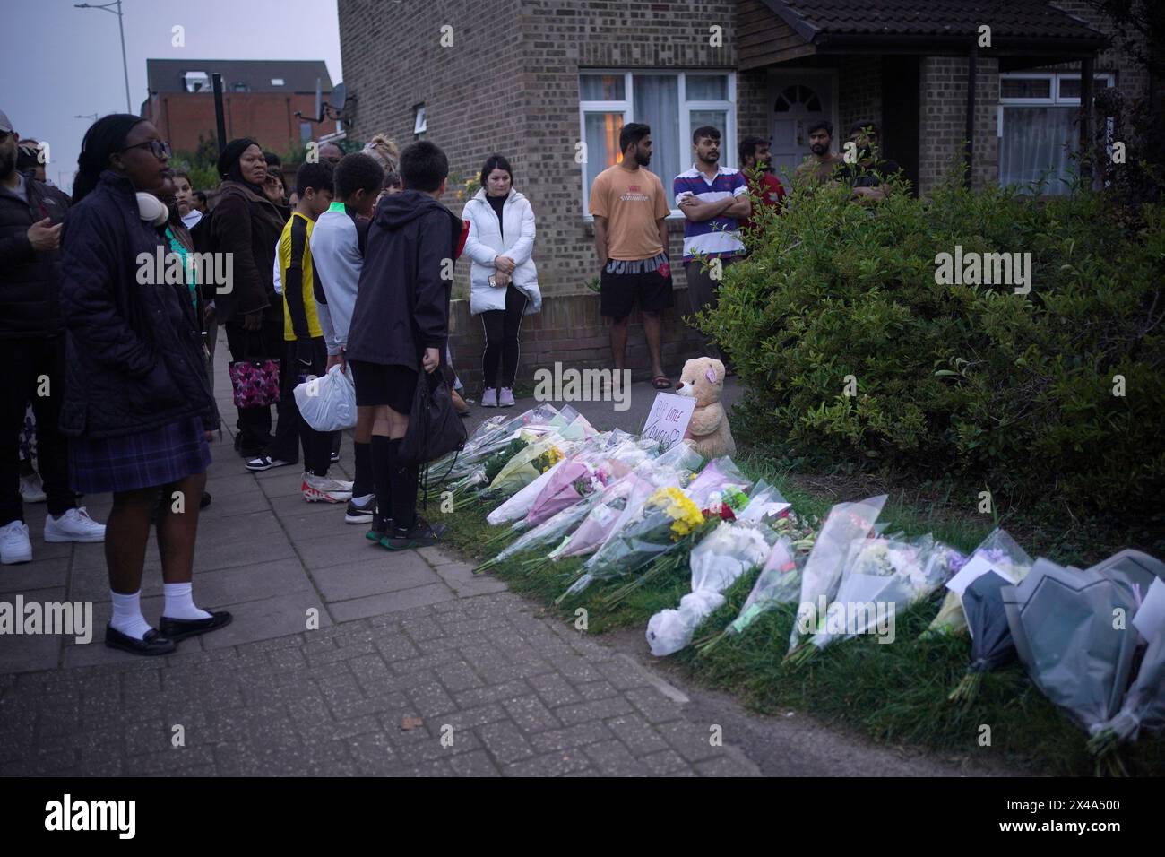 People Looking At Floral Tributes In Hainault, North East London, Where ...