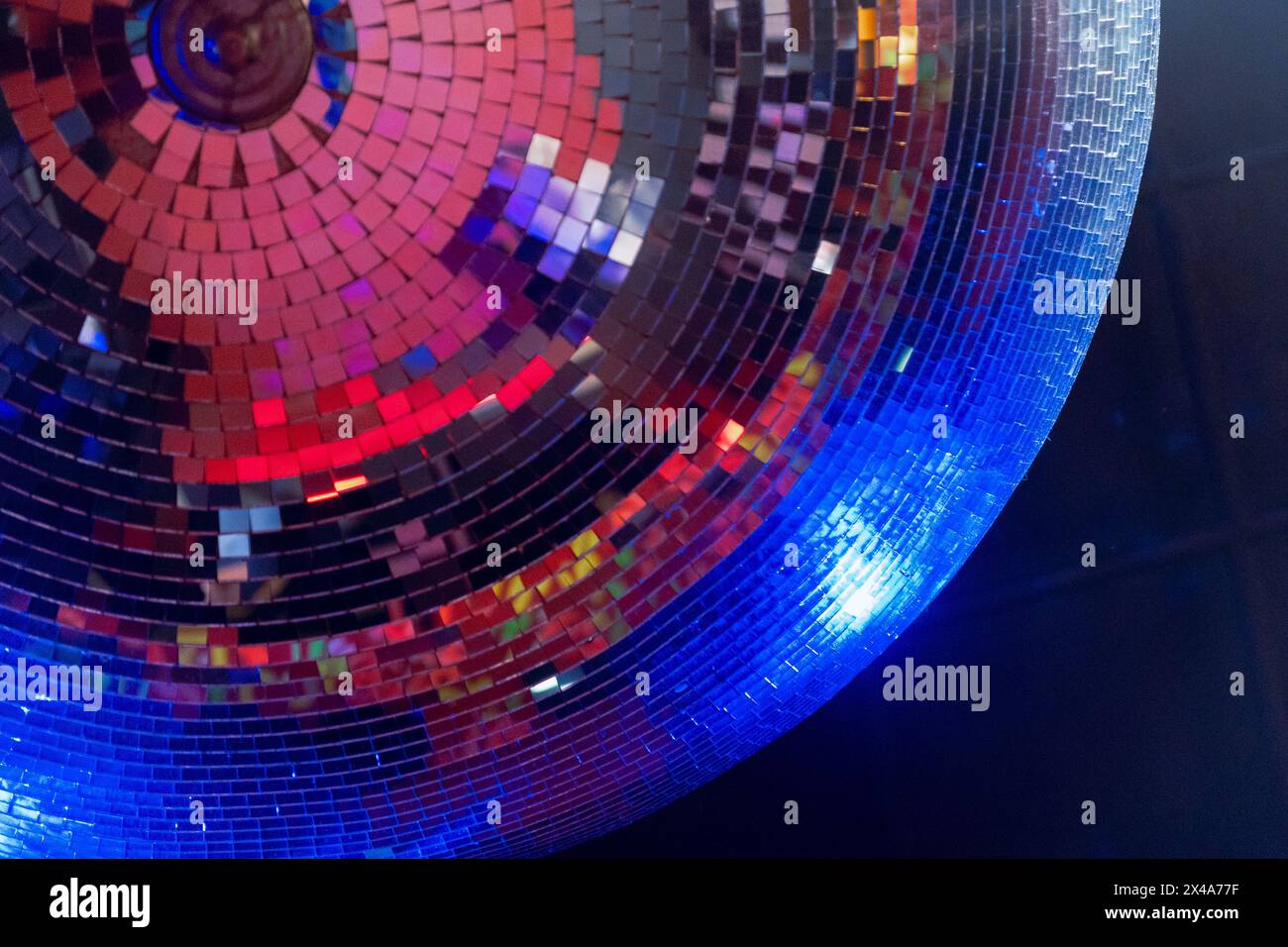 Detail of a Classic large disco ball made of small mirrors reflecting