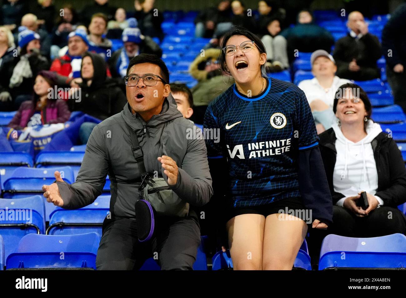 Chelsea fans celebrate after Liverpool goalkeeper Teagan Micah (not pictured) scores an own goal during the Barclays Women's Super League match at Prenton Park, Birkenhead. Picture date: Wednesday May 1, 2024. Stock Photo