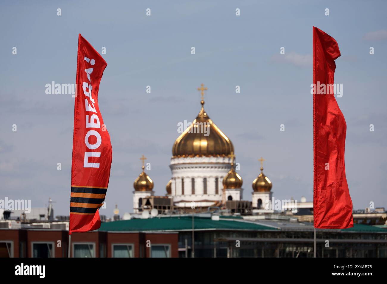 Red flags against the The Cathedral of Christ the Savior, Victory Day celebration in Moscow Stock Photo